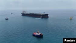 An oil tanker prepares to load crude oil at one of Iraq's southern offshore oil terminals near Basra in April.