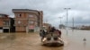 Military boats rescue people after flash flooding around the northern city of Aq Qala in Golestan province, Iran, Monday, March 25, 2019