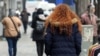 An Iranian woman, not wearing the mandatory hijab, walks in a street in the capital Tehran on December 12, 2024.