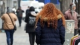 An Iranian woman, not wearing the mandatory hijab, walks in a street in the capital Tehran on December 12, 2024.