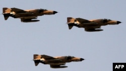 FILE PHOTO - Vietnam-era F-4 "Phantom" fighter jets fly during an annual military parade which marks Iran's eight-year war with Iraq, in Tehran, Sep. 22 2009