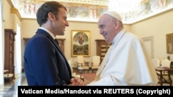 Pope Francis greets French President Emmanuel Macron at their previous meeting in November 2021.