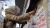 Serbia -- Activist Aida Ćorović, protest at the Milan Mladenović Plateau, in the center of Belgrade, due to new graffiti (mural) that celebrates convicted war criminal Ratko Mladić, November 25, 2021.