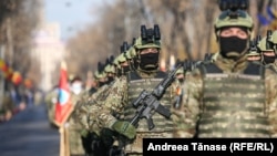 Military detachments participate in the rehearsal for the military parade organized on December 1, on the occasion of celebrating the National Day of Romania, at the Arc de Triumph in Bucharest.