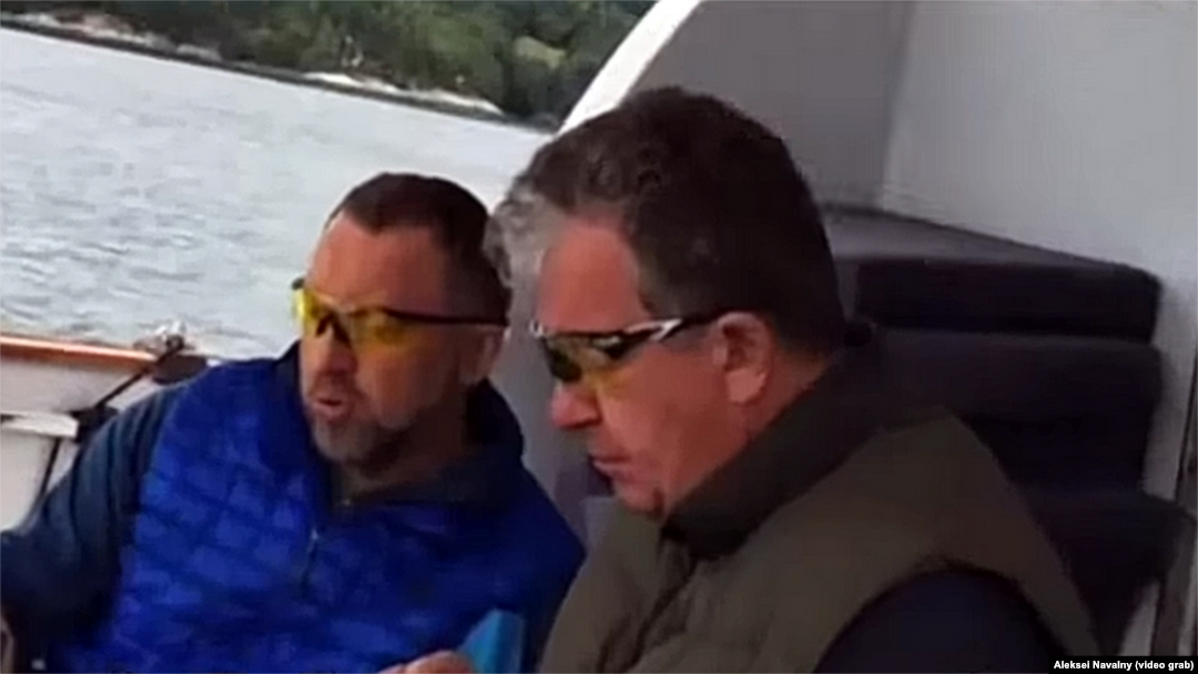 A video appears to show billionaire Oleg Deripaska (left) and Russian Deputy Prime Minister Sergei Prikhodko meeting on board the tycoon's yacht.
