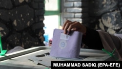 AFGHANISTAN -- An Afghan man casts his vote during the Parliamentary elections in Kandahar, Afghanistan, 27 October 2018.