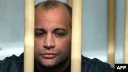 The pardon for Sergei Khadzhikurbanov, convicted of involvement in Anna Politkovskaya's killing, was "a monstrous instance of injustice and lawlessness," the late journalist's children and the staff of Novaya gazeta said. (file photo)