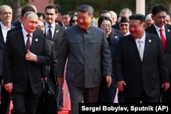 Putin, Chinese President Xi Jinping and North Korean leader Kim Jong Un arrive at a military parade in Beijing on September 3.