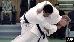 Russian Prime Minister Vladimir Putin (right) is honorary president of the European Judo Union and good friends with Marius Vizer, the Romanian-born Austrian president of the World Judo Federation.