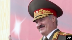 Belarusian President Alyaksandr Lukashenka reacts during a parade marking Independence Day in Minsk in July.