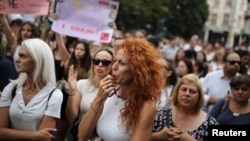 People demonstrate against lax laws on domestic violence in Sofia on July 31.