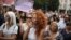 People demonstrate against lax laws on domestic violence in Sofia on July 31.