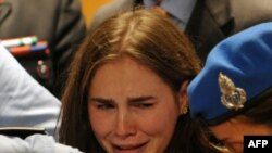 Amanda Knox reacts emotionally to the announcement of her acquittal at an appeal hearing in the Meredith Kercher murder case in Perugia. 