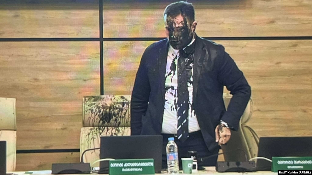 Black liquid was poured on Central Election Commission chief Giorgi Kalandarishvili during the November 16 session that validated the disputed election results.