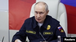 Russian President Vladimir Putin observes military exercises by Russia's Pacific Fleet in the Sakhalin region on August 12.