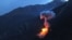 Two bombs explode at dusk on a Taliban fighting position above Kamdesh in Nuristan Province on June 11.