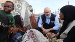 A World Food Program official visits a camp for internally displaced people in Mogadishu, Somalia, on May 7 to assess the knock-on effects of the conflict in the Middle East.