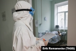 A doctor checks on patients in the COVID ward of a hospital in the city of Rostov-on-Don.