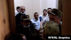 Armenia - Journalists try to interview paliament deputies and staffers involved in a bitter argument, December 7, 2021.