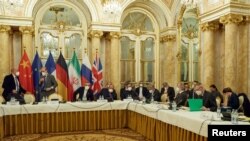 EU diplomat Enrique Mora and Iran's chief nuclear negotiator Ali Bagheri Kani wait for the start of a meeting of the JCPOA Joint Commission in Vienna on November 29, 2021. 