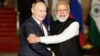 Russia's President Vladimir Putin shakes hands with India's Prime Minister Narendra Modi in New Delhi in December 2021.