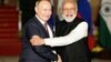 Russia's President Vladimir Putin (left) shakes hands with India's Prime Minister Narendra Modi in New Delhi on December 6.