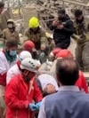 Iranian Emergency Workers Search For Survivors Trapped Under Rubble
