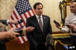 US Secretary of State Marco Rubio speaks to reporters before boarding a flight en route to Bahrain at Kuwait International Airport on June 24.