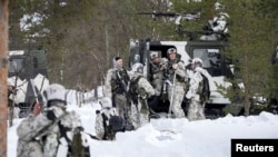Finnish hunter soldiers attend training with Swedish units as part of NATO's Nordic Response exercise in Hetta, Finland, in March.