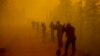 Volunteers pause while working at the scene of a forest fire west of Yakutsk on August 7.