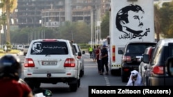 A painting depicting Qatar’s Emir Sheikh Tamim Bin Hamad Al-Thani is seen on a bus during a demonstration in support of him in Doha, Qatar June 11, 2017.