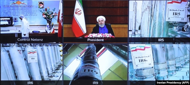 A screen grab from a videoconference showing views of centrifuges and devices at Iran's Natanz plant, as well as Iranian President Hassan Rohani delivering a speech, to mark Iran's National Nuclear Technology Day on April 10.