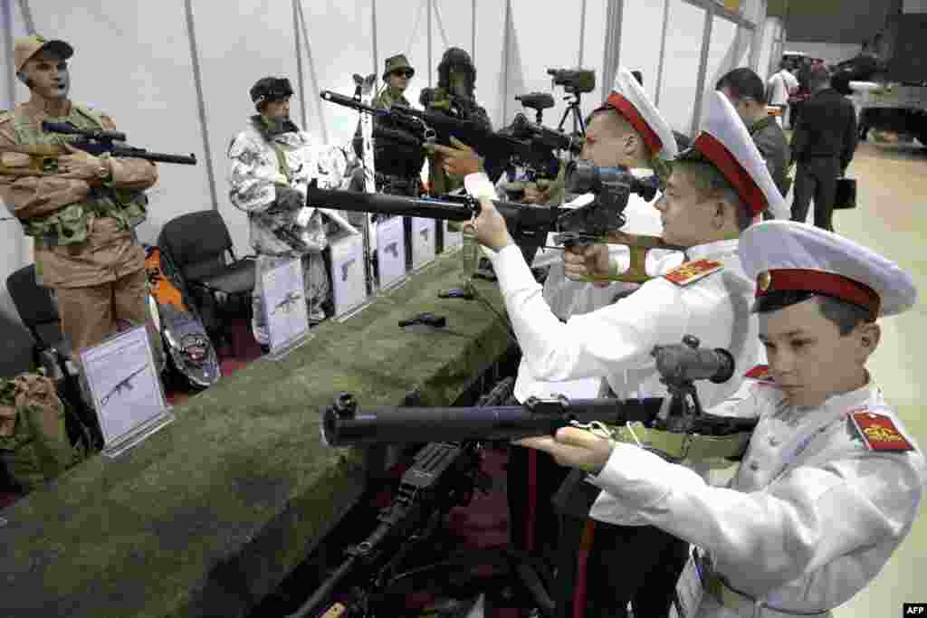 Russian military cadets check out weapons at a military exhibition in Rostov-on-Don. (AFP/Sergei Venyavsky)