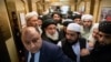 Taliban officials gets into an elevator as they attends the "intra-Afghan" talks in Moscow on February 6.