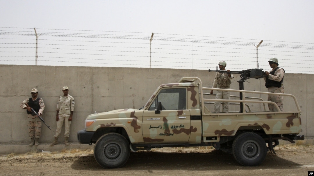 Iranian border guards stand at their country's frontier with Iran in the village of Milak. (file photo)