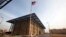 A U.S. flag flies in front of the Annex I building inside the compound of the U.S. Embassy in Baghdad. (file photo)
