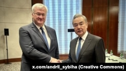 Андрей Сибига менен Ван И