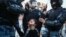 RUSSIA – MOSCOW, JULY 27, 2019: Police officers detain a woman during an unauthorized rally in support of rejected independent candidates in the upcoming Moscow City Duma [Moscow parliament] election held by Russian opposition in Trubnaya Square. 