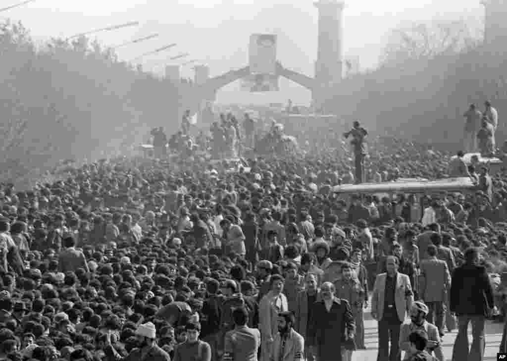 A crowd listens to Khomeini address them at&nbsp;Behesht-e Zahra cemetery. An estimated five million people gathered in Tehran to show support.