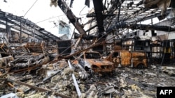 A car service center in eastern Tehran was damaged by a missile strike on March 28. 