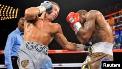 Kazakh boxer Gennady Golovkin (left, shown in 2013 match) seeks to defend his titles on September 15.