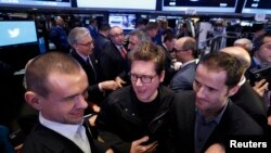 Twitter chief Jack Dorsey (left) on the floor of the New York Stock Exchange in 2013.