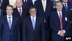 NATO Secretary General Anders Fogh Rasmussen, US Defense Secretary Leon Panetta and Britain's Secretary of Defense Philip Hammond pose for a photo at the NATO Defense Ministers meeting at the NATO headquarter in Brussels