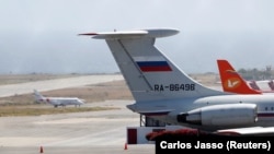 An airplane with the Russian flag is seen at Simon Bolivar International Airport in Caracas on March 24.