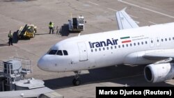 An IranAir Airbus A320 passengers aircraft parks after landing at Belgrade's Nikola Tesla Airport, March 13, 2018