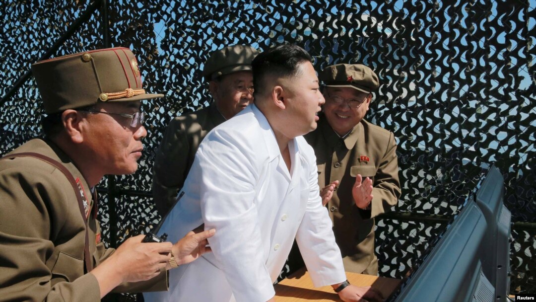 North Korea -- North Korean leader Kim Jung Un supervises a demonstration of a new rocket engine for the geo-stationary satellite at the Sohae Space Center, undated