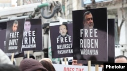 Armenia- People hold pictures of Armenian prisoners held in Azerbaijan during a demonstration in Yerevan, March 3, 2025.