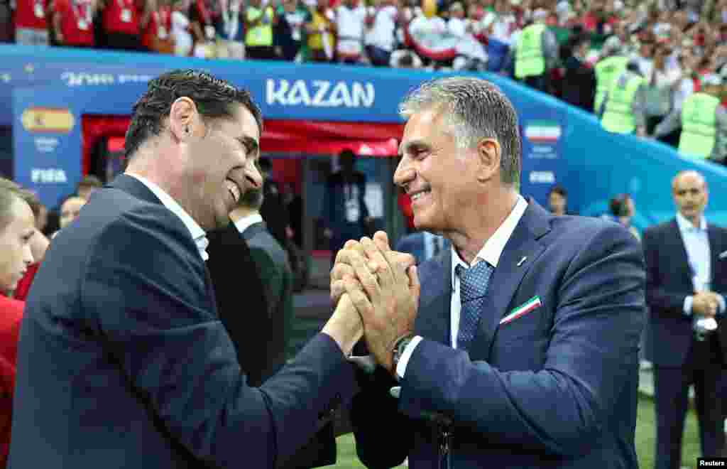 Soccer Football - World Cup - Group B - Iran vs Spain - Kazan Arena, Kazan, Russia - June 20, 2018 Spain coach Fernando Hierro shakes hands with Iran coach Carlos Queiroz before the match REUTERS/Sergio Perez