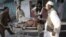 A man injured in the September 4 bomb blast is wheeled into a hospital in Jalalabad.