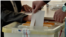 Armenia - A voter in Hrazdan casts a ballot in a local election, October 25, 2026.
